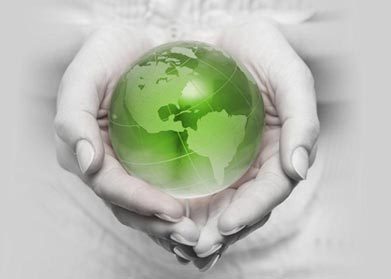 Small investment today will go a long way to build wealth for tomorrow.  Hands Holding Green Earth Globe